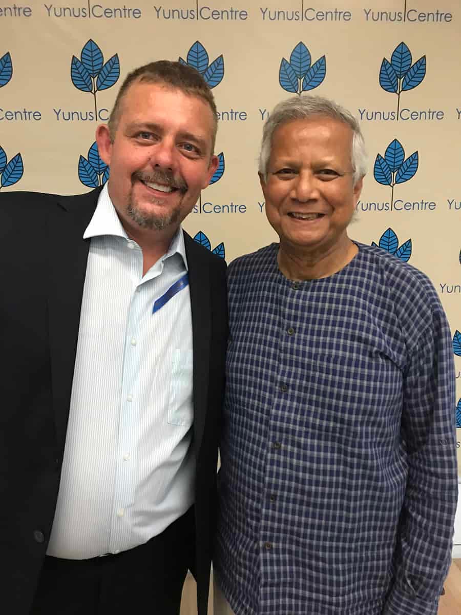 Tim Johnson with Professor Muhammad Yunus (Nobel Peace Prize Winner)